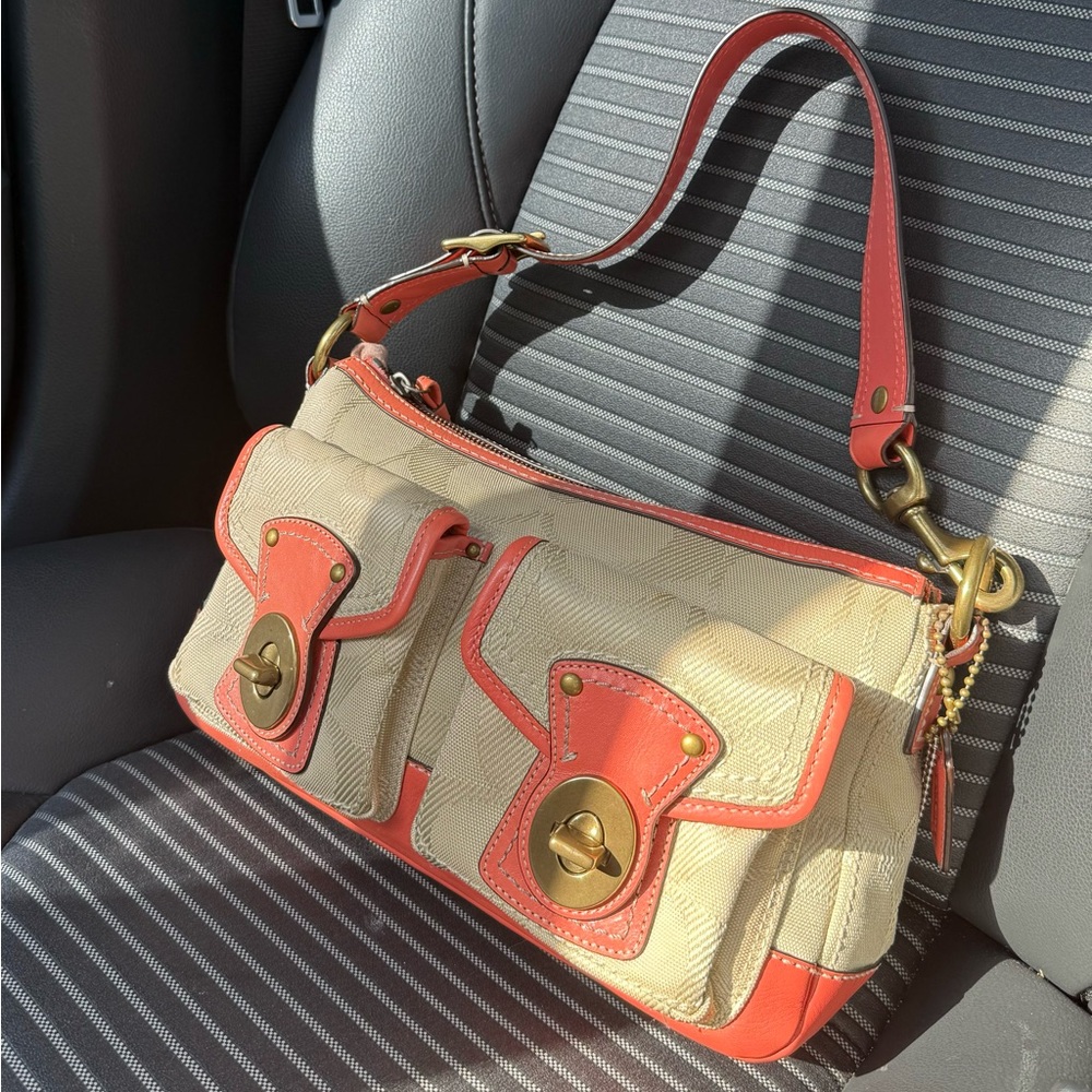 Vintage pink and tan Coach Legacy bag.